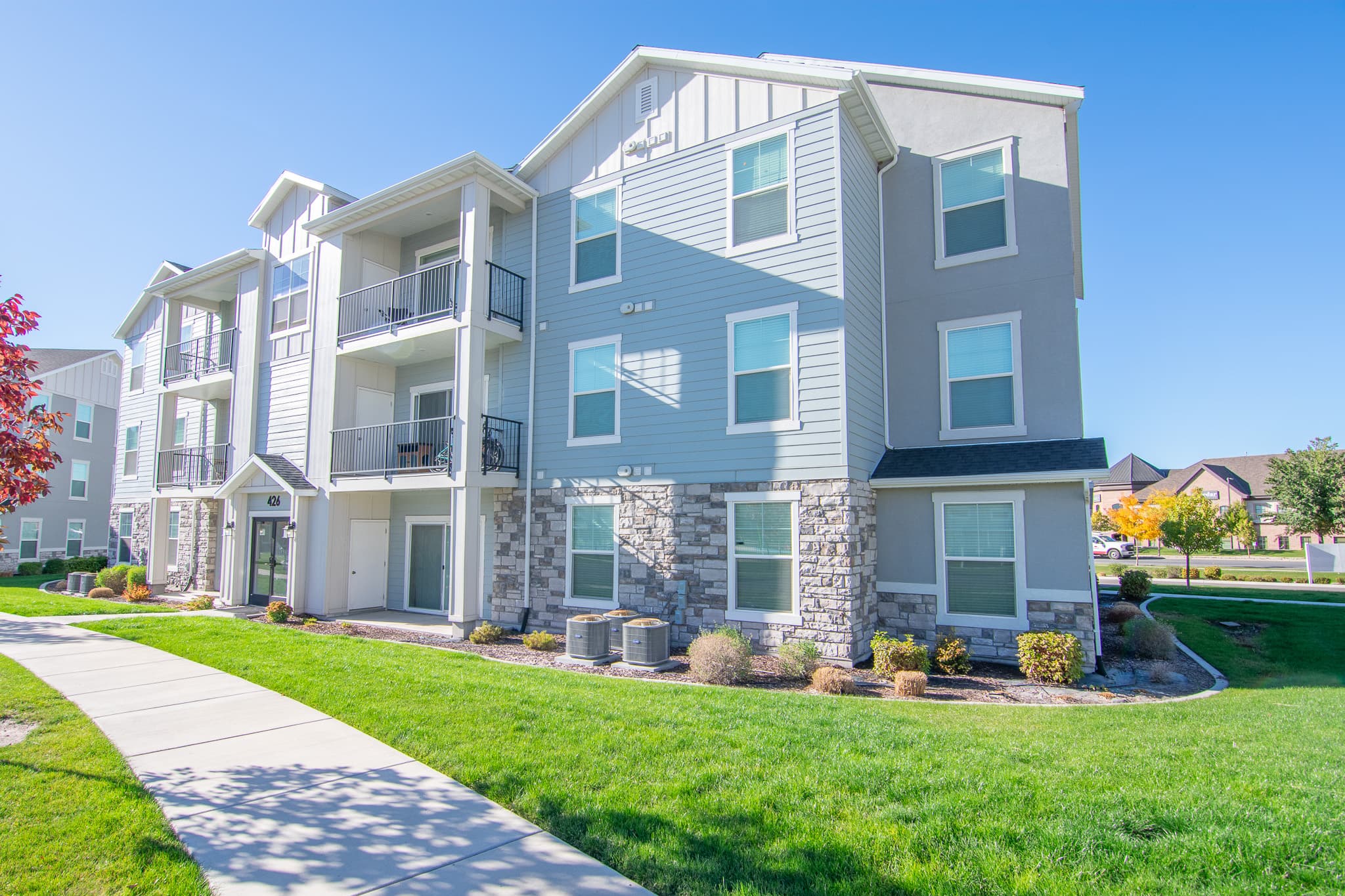 Condo building exterior with Wasatch Mountain views